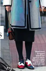  ??  ?? Dual-tone
brogues stand out against black opaque tights
and a welltailor­ed coat