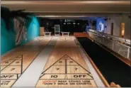  ?? PHOTO PROVIDED ?? Former bowling alley lanes now serve as shuffleboa­rd courts at Franklin Alley Social Club, which will open on Friday in downtown Troy.