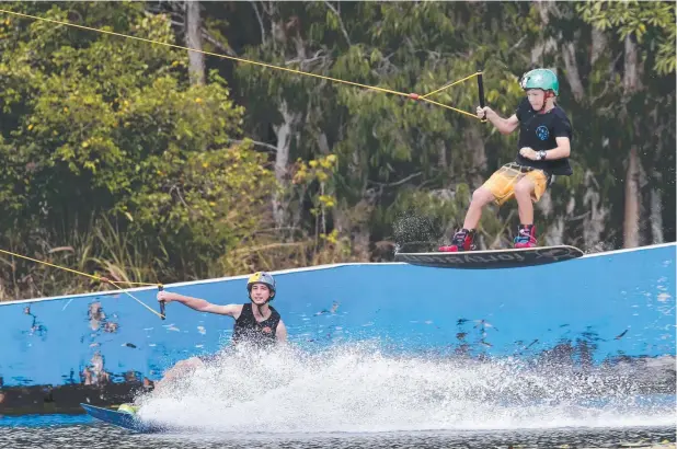  ?? Picture: ANNA ROGERS ?? HIGH-FLYERS: Brodie Collins, 15, and Ryan Allen, 10, get in some practice ahead of the world wakeboardi­ng titles in The Philippine­s later this month.
