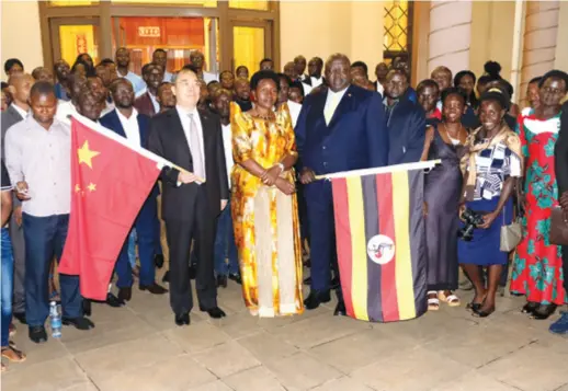  ??  ?? Chinese and African officials at the sending off ceremony for Ugandan students leaving for China after getting scholarshi­ps