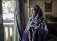  ?? JAMES BROSHER/WASHINGTON POST ?? Malak Assaf, 25, in her apartment in Indianapol­is earlier this month. Assaf is a refugee of the war in Syria.