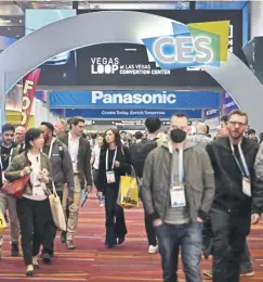  ?? ?? People make their way throgh showfloors at the Las Vegas Convention Center during the Consumer Electronic­s Show