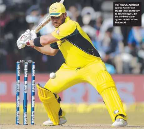  ?? TOP KNOCK: Australian opener Aaron Finch shapes to cut on his way to a match- high 124 in the third one- dayer against India in Indore. Picture: AP ??