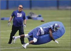  ??  ?? New York Giants' Dominique Rodgers-Cromartie (right) participat­es in a NFL football practice Wednesday in East Rutherford, N.J. AP PHOTO