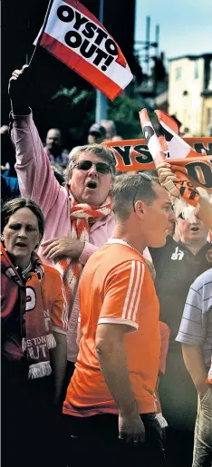  ??  ?? Boycott at Bloomfield Road: Blackpool fans protest against club owner Owen Oyston, and (left) supporters’ trust chairman Steve Rowland outside the ground