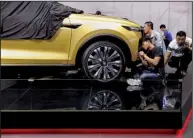  ?? AP/ NG HAN GUAN ?? for the Shanghai auto show at the city’s National Exhibition and Convention Center on Tuesday.