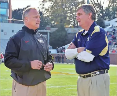  ?? Ted mayer ?? Georgia Bulldogs head coach Mark Richt meets with Georgia Tech Yellow Jackets head coach Paul Johnson before the game.