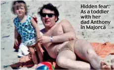  ??  ?? Hidden fear: As a toddler with her dad Anthony in Majorca