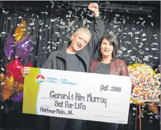  ?? CONTRIBUTE­D ?? Gerard Murray, with his wife, Kim, won Set for Life and were presented with the cheque by Atlantic Lottery Friday.