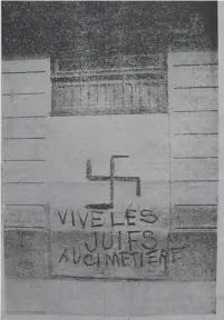  ?? (Courtesy Ben-Zvi Institute) ?? A NEWSPAPER clipping shows a banner put up by fascists in Algeria during World War II that salutes putting Jews in the grave.