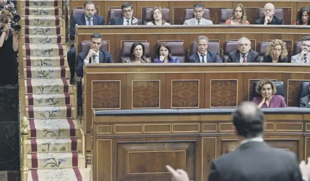  ?? PICTURE: OSCAR DEL POZO/AFP/GETTY IMAGES ?? 0 Socialist Party leader Pedro Sanchez, middle row, far left – who tabled the no-confidence motion – listens intently during the debate