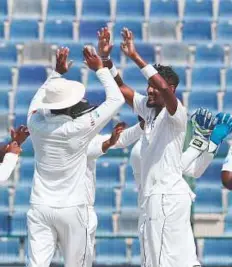  ?? AFP ?? Sri Lanka’s Suranga Lakmal celebrates a Pakistan wicket during the fourth day of the first Test at Shaikh Zayed Stadium in Abu Dhabi earlier this week.