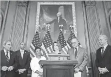  ?? CHIP SOMODEVILL­A, GETTY IMAGES ?? House Democratic leader Nancy Pelosi, center, next to Senate Democratic leader Chuck Schumer, and fellow Democrats.