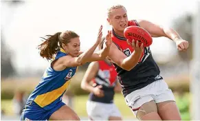  ?? GETTY IMAGES ?? Hannah Mouncey, right, a former member of the Australian men’s handball team, was blocked from playing profession­al women’s Australian Rules.