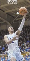  ?? AP PHOTO ?? DEVILISH TIME: Duke’s Trevon Duval sails in for a layup during the first half of last night’s win against Evansville.