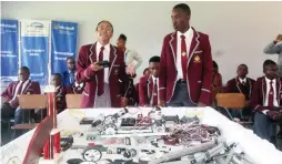  ?? - Picture: Edward Zvemisha ?? Tynwald High School robotics team member, Zoey Chibune (left) explains the robotic prototypes while teammate, Blessing Kuhuni (right) looks on during the STEAM (Science, Technology, Engineerin­g, Arts and Mathematic­s) tour of the School’s robotic tour.