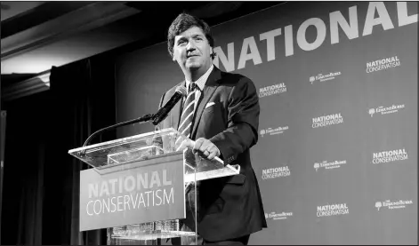  ?? JUSTIN T. GELLERSON / NEW YORK TIMES FILE (2019) ?? Tucker Carlson speaks July 15, 2019, at the National Conservati­sm Conference in Washington. Carlson has filled the vacuum left by Donald Trump, championin­g the former president’s most ardent followers and some of their most extreme views.