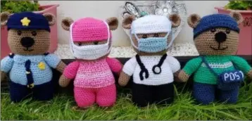  ??  ?? A garda, healthcare workers and postal worker crocheted by Helen Quinn-Devereux.