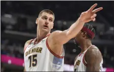  ?? DAVID ZALUBOWSKI — THE ASSOCIATED PRESS ?? Denver Nuggets center Nikola Jokic gestures after being called for a foul in the second half against the Charlotte Hornets on Sunday at Ball Arena.