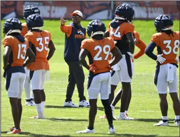  ?? RJ SANGOSTI — THE DENVER POST ?? Broncos defensive backs coach Christian Parker has already had one interview for a defensive coordinato­r opening and may could be on the way.