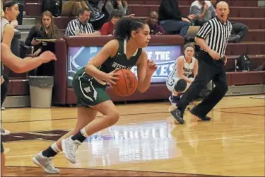  ?? JEN FORBUS — THE MORNING JOURNAL ?? Westlake’s Abby Carrington sprints for her basket after a turnover during the Demons’ game against Rocky River.