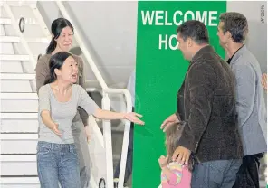  ??  ?? Euna Lee (left rear) and Laura Ling (left), American journalist­s who were arrested for allegedly crossing into North Korea from China, are welcomed home in California in August 2009 after being detained in North Korea for nearly five months.