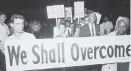  ?? ?? Civil rights demonstrat­ors protest at the 1964 Democratic National Convention.