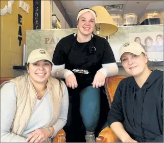  ?? CHERYL A. CUDDAHY / SENTINEL & ENTERPRISE ?? Alex Valeri-Marcelino, Victoria Valeri and Tara Petricca, co-owners of Pammy’s Place in Fitchburg, lounge in the vintage orange chairs.