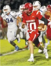  ?? STAFF FILE PHOTO BY C.B. SCHMELTER ?? Lakeview-Fort Oglethorpe’s Zach Vaughn carries the ball against Ringgold earlier this season at LFO’s Tommy Cash Stadium. Vaughn was selected the prep player of the week for his play last Friday against Murray County.