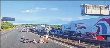  ??  ?? People sprawl out, sunbathe, play football and even hula hoop on the closed M20