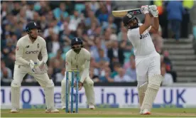  ?? Photograph: Tom Jenkins/ The Observer ?? Rohit Sharma brings up his century with a six off Moeen Ali.