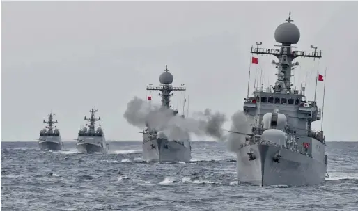  ?? AP ?? A South Korean navy ship fires during a drill in the East Sea. South Korean warships conducted live-fire exercises at sea on Tuesday. —