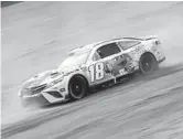  ?? CHRIS GRAYTHEN/GETTY ?? Kyle Busch drives during first practice for the NASCAR Cup Series Food City Dirt Race on Friday at Bristol Motor Speedway in Bristol, Tennessee.