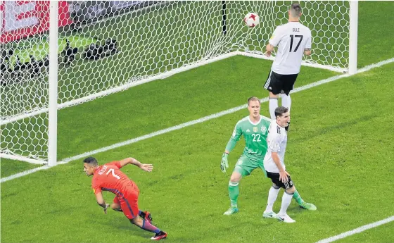  ??  ?? Chile’s Alexis Sanchez, left, reacts after scoring against Germany.