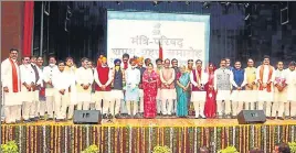  ?? PTI ?? Uttar Pradesh governor Anandiben Patel and Madhya Pradesh chief minister Shivraj Chouhan with the newly inducted ministers at Raj Bhawan in Bhopal on Thursday.