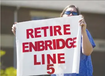  ?? THE ASSOCIATED PRESS/FILES ?? Lauren Sargent of Ann Arbor, Mich., protests Line 5 in 2017.