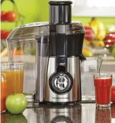  ??  ?? The “Big Mouth” juice extractor from Hamilton Beach has a three-inch chute for whole fruits and veggies.