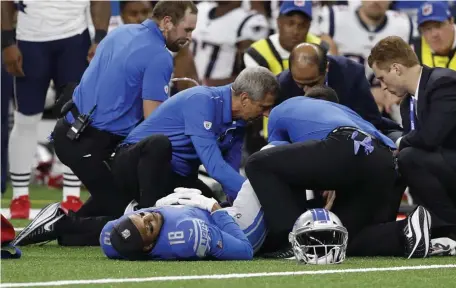  ?? ASSOCIATED PRESS ?? ALL DONE: Lions receiver Jermaine Kearse is treated during his team’s loss the Pats Thursday night. Kearse was put on injured reserve yesterday with a leg injury.