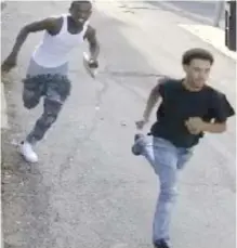  ??  ?? A surveillan­ce photo of the men who allegedly attacked and robbed an 80- year- old woman Tuesday in the 1400 block of West Lill Street.
| CPD