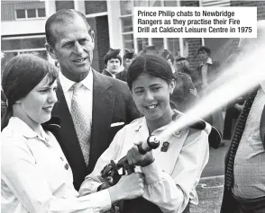  ??  ?? Prince Philip chats to Newbridge Rangers as they practise their Fire Drill at Caldicot Leisure Centre in 1975