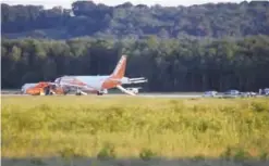  ??  ?? COLOGNE: In this photo taken from video yesterday, a EasyJet plane stands at Cologne-Bonn airport. — AP