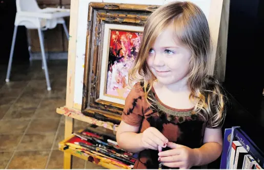  ?? Jen Gerson / National Post ?? Four-year-old Cosette Swart has raised almost $4,000 for World Vision by selling 40 of her abstract paintings. Cosette
started paying attention to the plight of disadvanta­ged children in Africa and was moved to help the “poor people.”