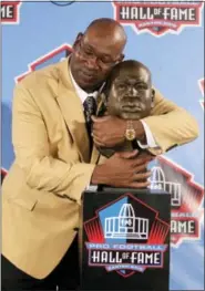  ?? ASSOCIATED PRESS FILE PHOTO ?? Former NFL player Cortez Kennedy poses with a bust of himself during the induction ceremony at the Pro Football Hall of Fame, in Canton, Ohio in August of 2012. The Orlando Police Department confirmed that Kennedy was found dead Tuesday in Orlando.