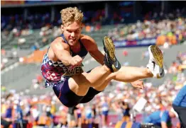  ?? — AFP ?? Kevin Mayer competes in the men’s decathlon long jump event in the European Athletics Championsh­ips at the Olympic stadium in Berlin on Tuesday.