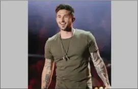  ?? PHOTO BY WADE PAYNE — INVISION — AP, FILE ?? In this file photo, Michael Ray performs “Firestone” at the CMT Music Awards in Nashville, Tenn.
