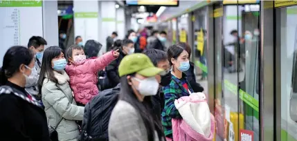  ??  ?? People wearing face masks wait for a subway train on the first day the city’s subway services resumed following the novel coronaviru­s disease (COVID-19) outbreak, in Wuhan of Hubei, China.