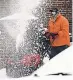  ?? NAM Y. HUH/ AP ?? A man clears snow Sunday in Evanston, Ill., where a cold front promised more wintry weather this week.