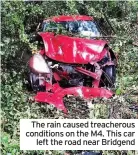  ??  ?? The rain caused treacherou­s conditions on the M4. This car left the road near Bridgend