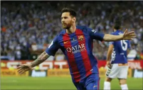  ?? DANIEL OCHOA DE OLZA — THE ASSOCIATED PRESS ?? Barcelona’s Lionel Messi, on Wednesday, has agreed to extend his contract that will tie him to the Spanish club through June 30, 2021.