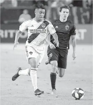  ?? KIRBY LEE/USA TODAY SPORTS ?? LA Galaxy midfielder Efrain Alvarez, left, has been named to the MLS Homegrown Game roster ahead of the match Tuesday at ESPN Wide World of Sports.
